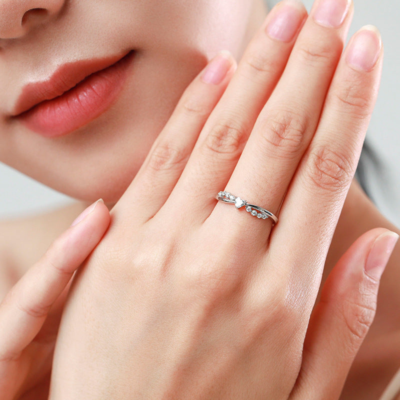 Damenring mit kunstvollem Zirkonia-Besatz und elegantem Wellen-Design Shop Nory