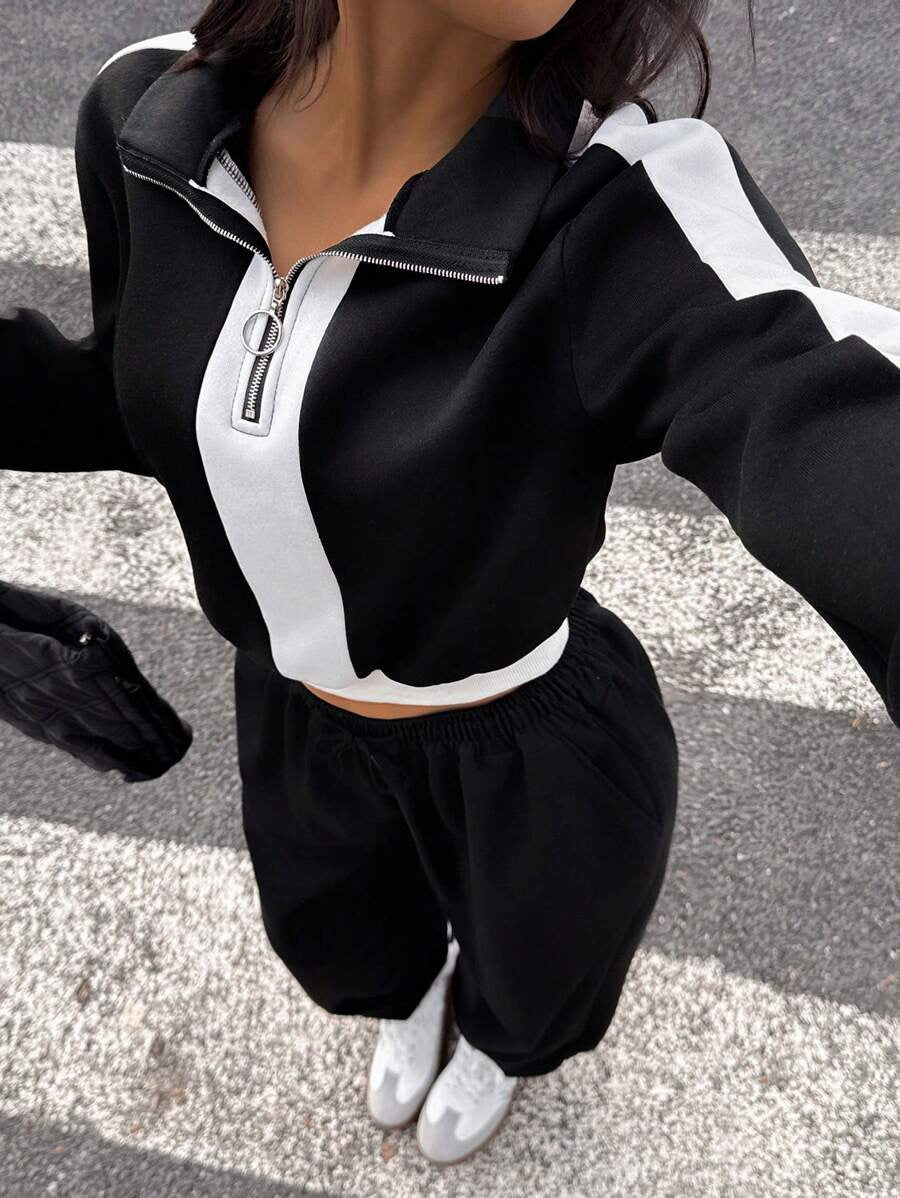 Damen kurzes Sweatshirt mit Halbreißverschluss und elastischer Bund Jogginghose Set Shop Nory