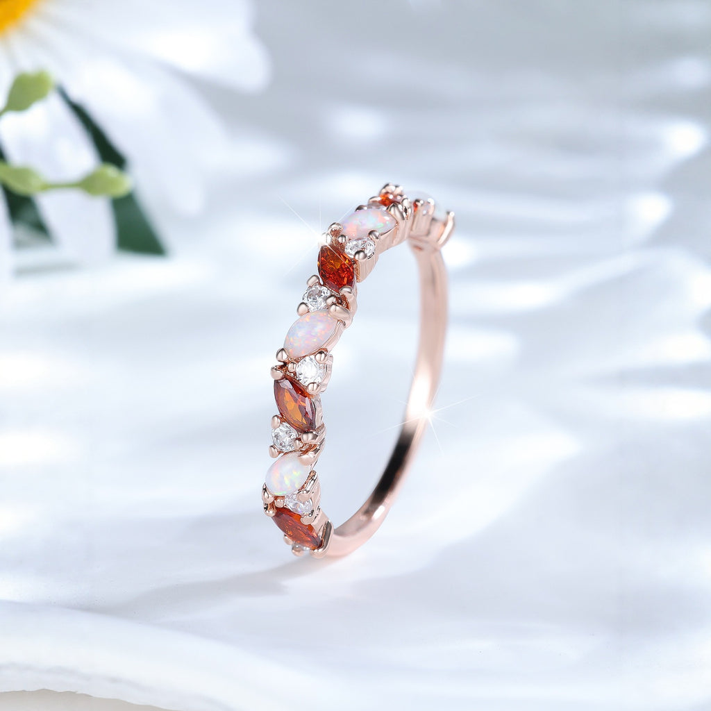 Damen Ring mit funkelnden Opalen und facettierten Granatsteinen Shop Nory