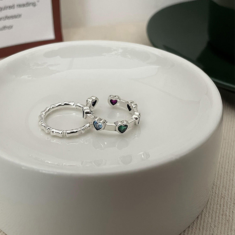 Damenring mit herzförmigen Steinchen und elegantem Design Shop Nory