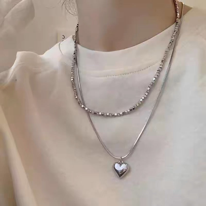 Damen Halskette mit herzförmigem Anhänger und modernem Gliederdesign Shop Nory