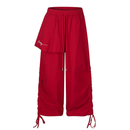 Damen Weite Capri-Hose mit Tunnelzug, seitlicher Raffung und asymmetrischer Überlagerung Shop Nory