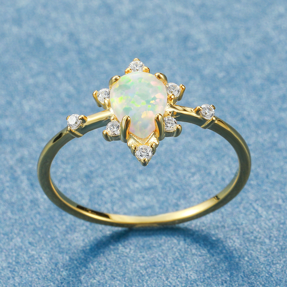 Damen Ring mit funkelndem Tropfen-Opal und elegantem Zirkonia-Design Shop Nory
