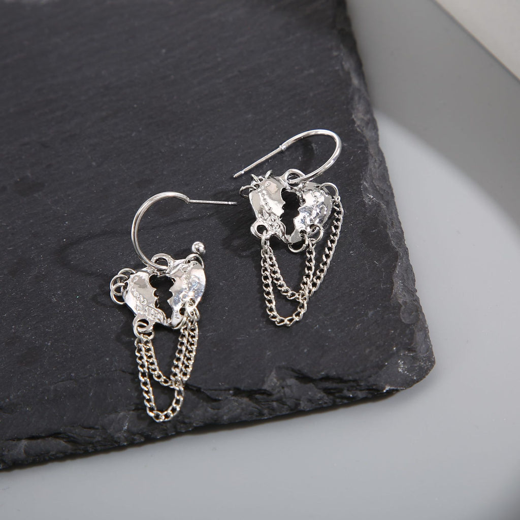 Damen Ohrringe mit funkelnden herzförmigen Anhängern und eleganten Kettendetails Shop Nory