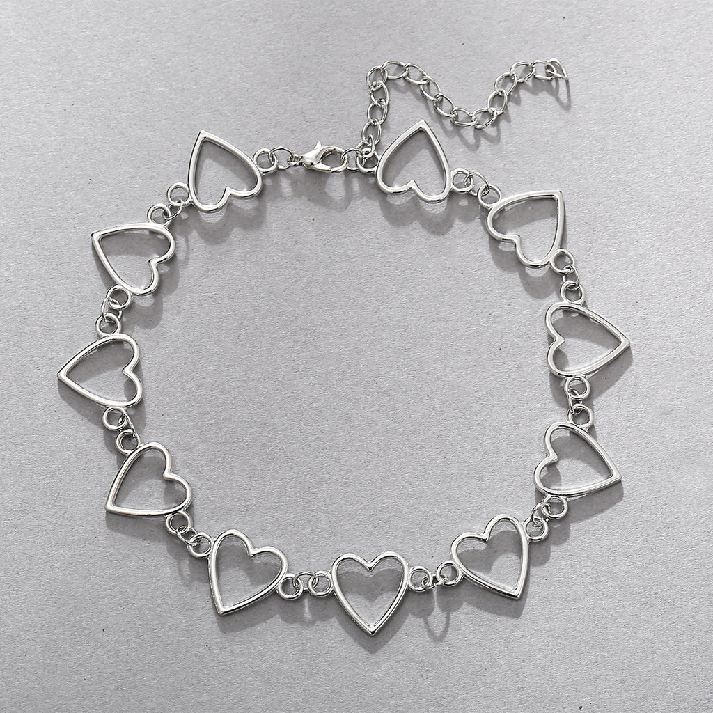 Damenarmband mit funkelnden Herzanhängern Shop Nory
