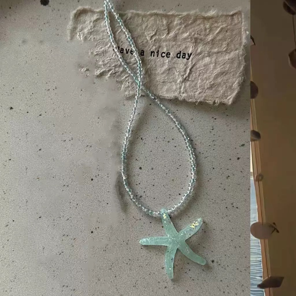 Damen Kette mit verspieltem Sternenanhänger und bunten Perlen Shop Nory
