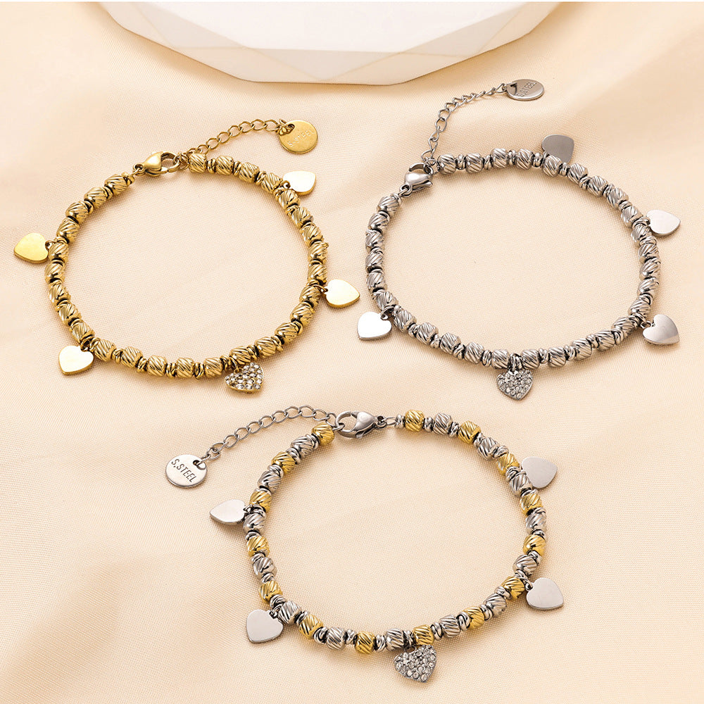 Damen Armband mit herzförmigen Anhängern und funkelndem Zirkonia Shop Nory