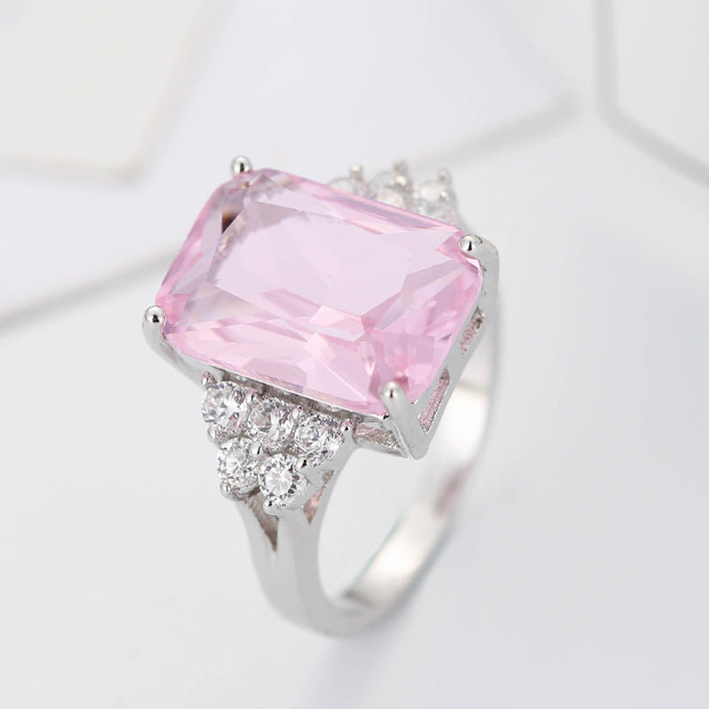 Damen luxuriöser Schmuckring mit rechteckigem pinkem Stein und funkelnden Zirkonia Shop Nory