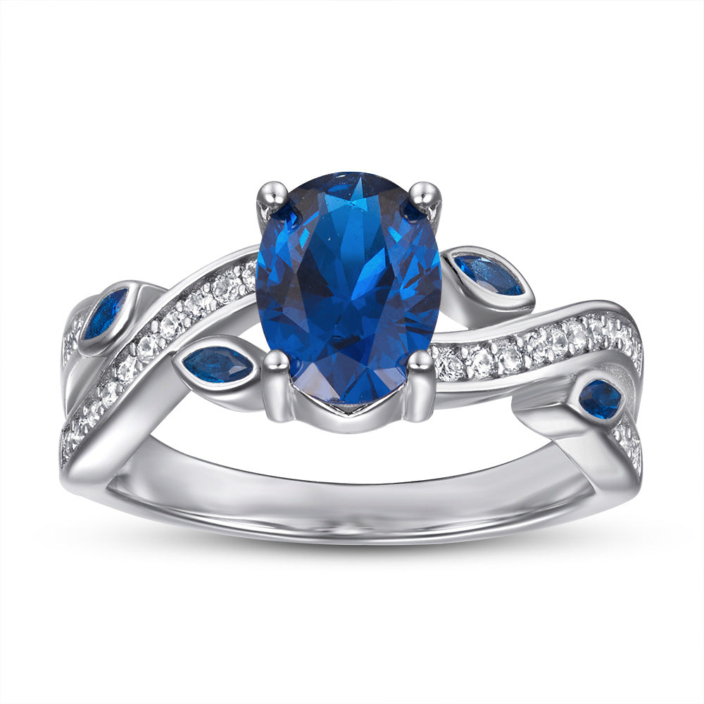 Damenring mit elegantem, geschwungenem Design und funkelnden Zirkoniasteinen Shop Nory