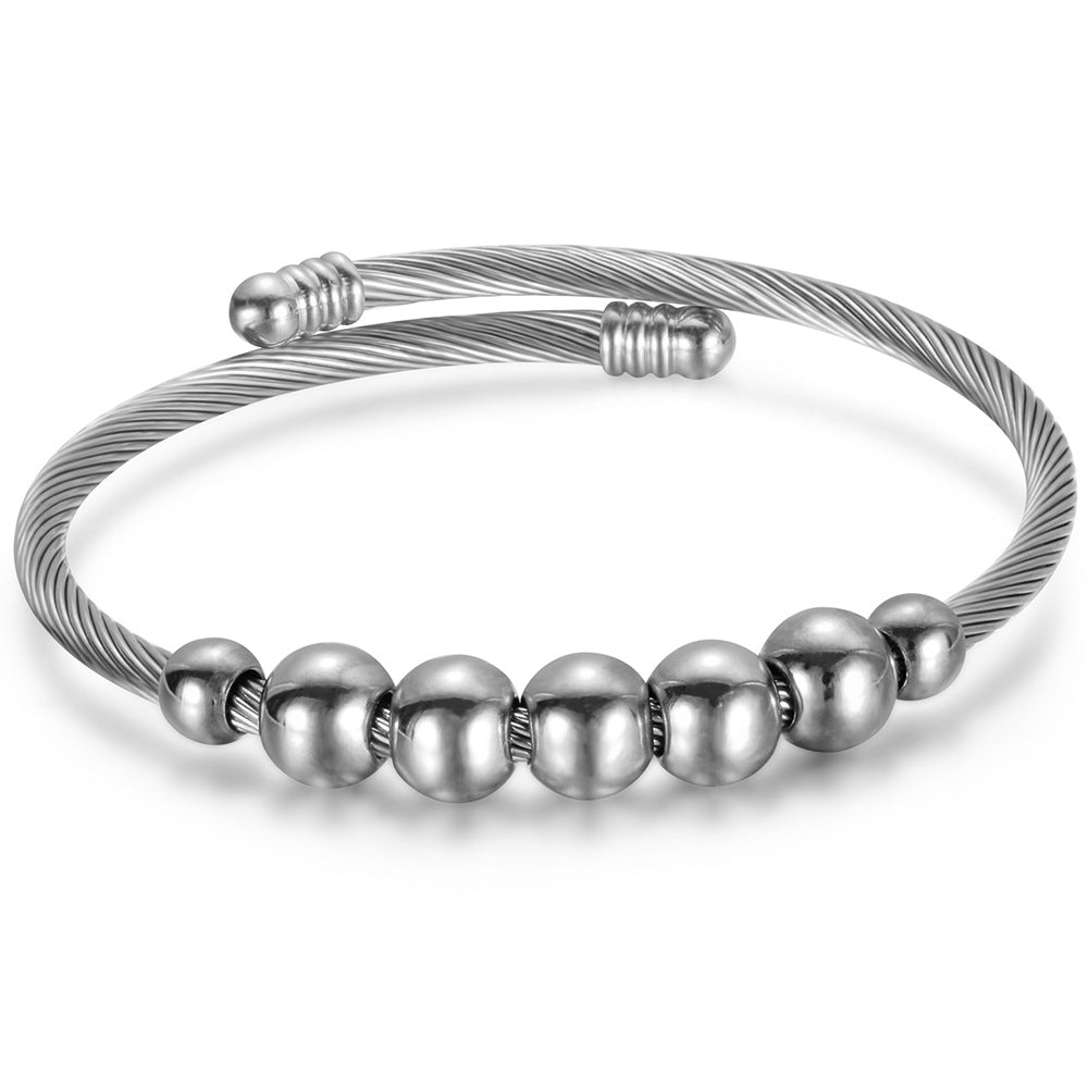 Damen Armreif mit elegantem, geschwungenem Drahtdesign und glänzenden Metallakzenten Shop Nory