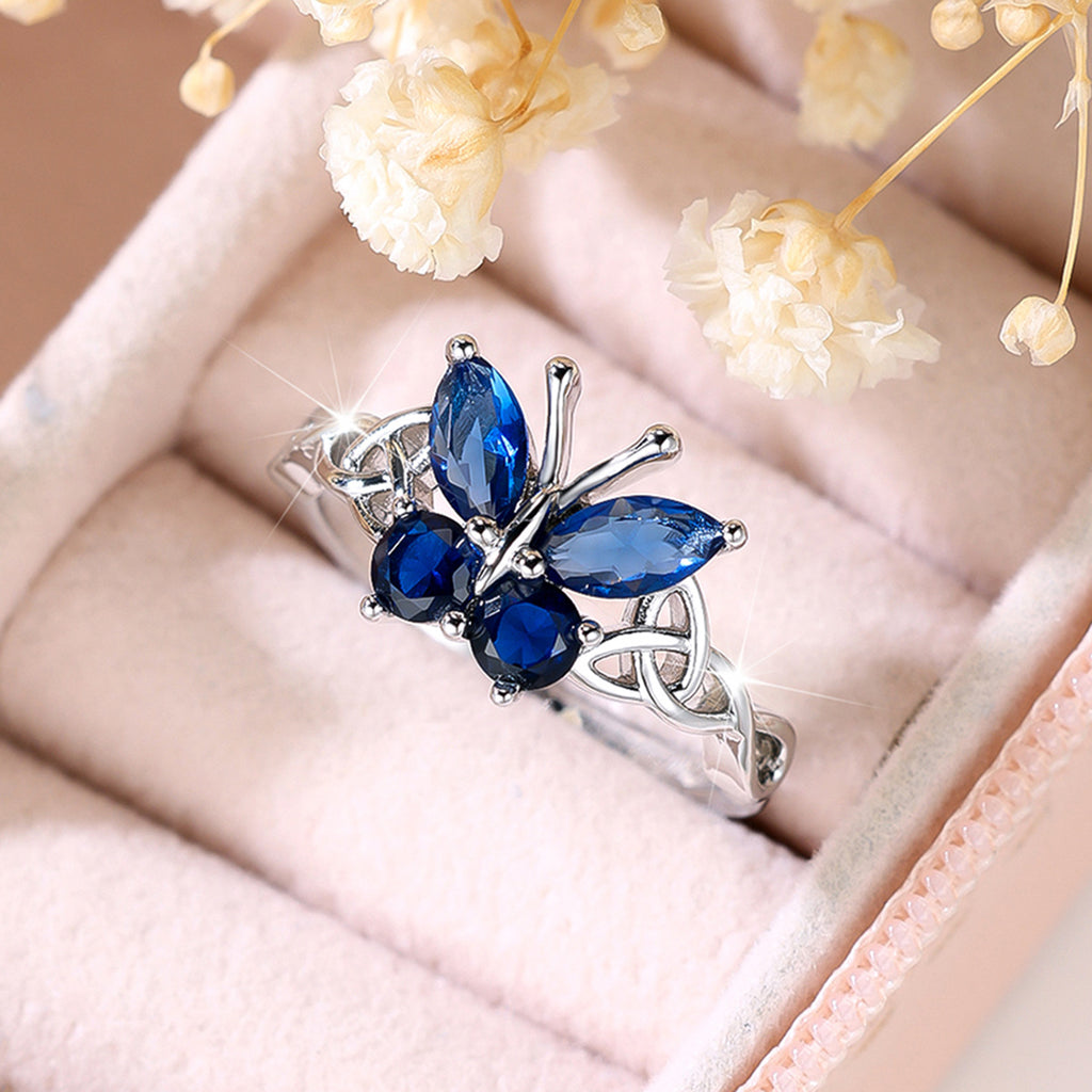 Damen Ring mit kunstvollem Schmetterlingsdesign und schimmernden Opal-Elementen Shop Nory