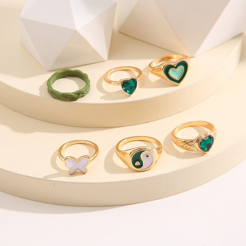 Damen modisches Mehrfach-Ringset mit bunten und symbolischen Designs Shop Nory