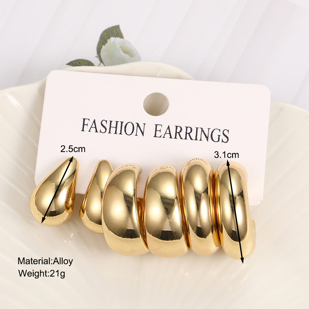 Damen modische Ohrringe mit geschwungenem Designs und glänzenden Oberflächen Shop Nory