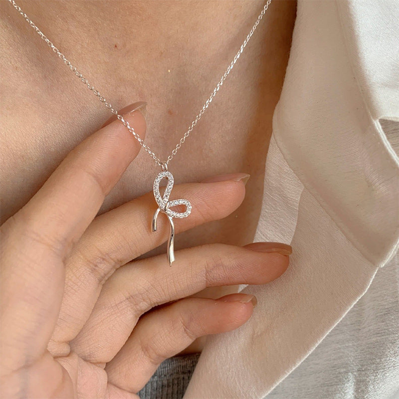 Damen Halskette mit elegantem Schleifenanhänger Shop Nory