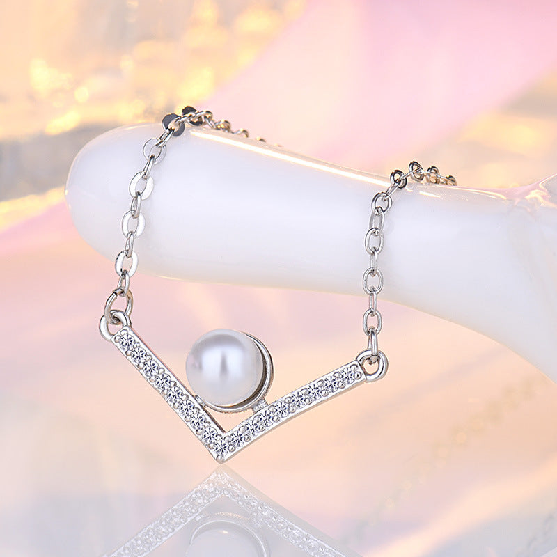 Damen Halskette aus hochwertigem Edelstahl mit eleganter Perle und funkelnden Zirkonia-Elementen Shop Nory