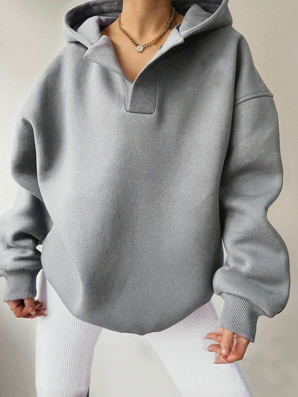 Damen Kapuzensweater mit übergroßem Schnitt und V-Ausschnitt