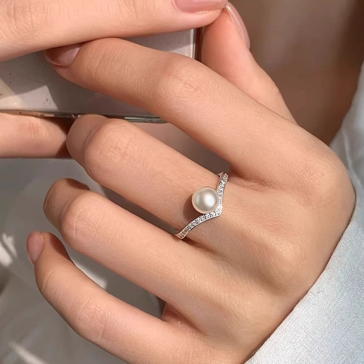 Damen Ring mit modernem geschwungenem Design und Perlenakzent Shop Nory