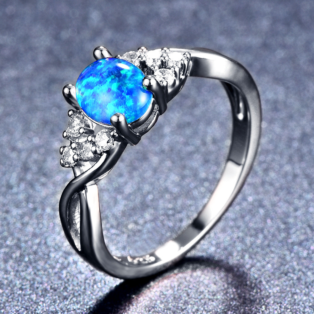 Damen Ring mit schimmerndem Opal und Zirkonia-Verzierungen Shop Nory