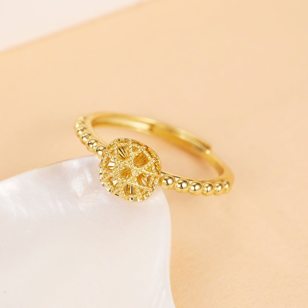 Damen goldfarbener Ring mit filigranem Blütenanhänger und eleganter Kugelkette Shop Nory