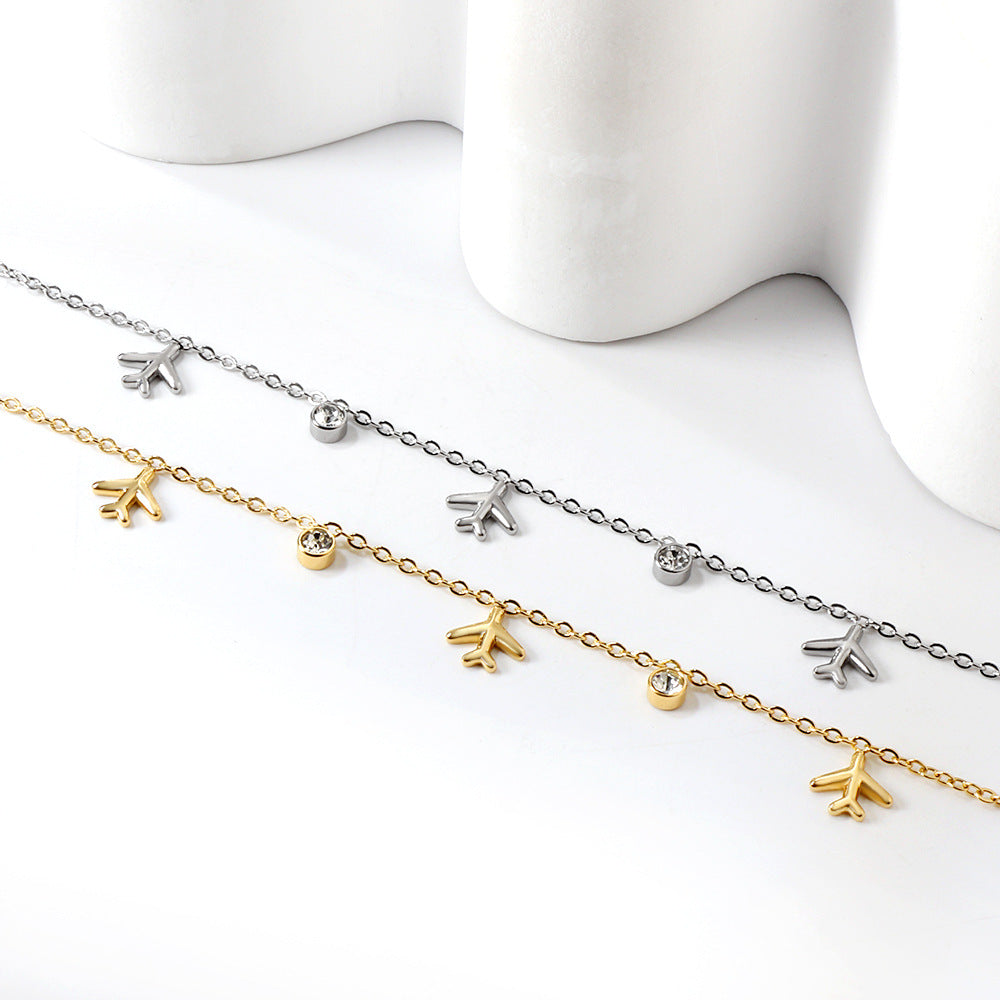 Damen Armband mit stilvollen Flugzeug-Anhängern aus antiallergischem Edelstahl Shop Nory
