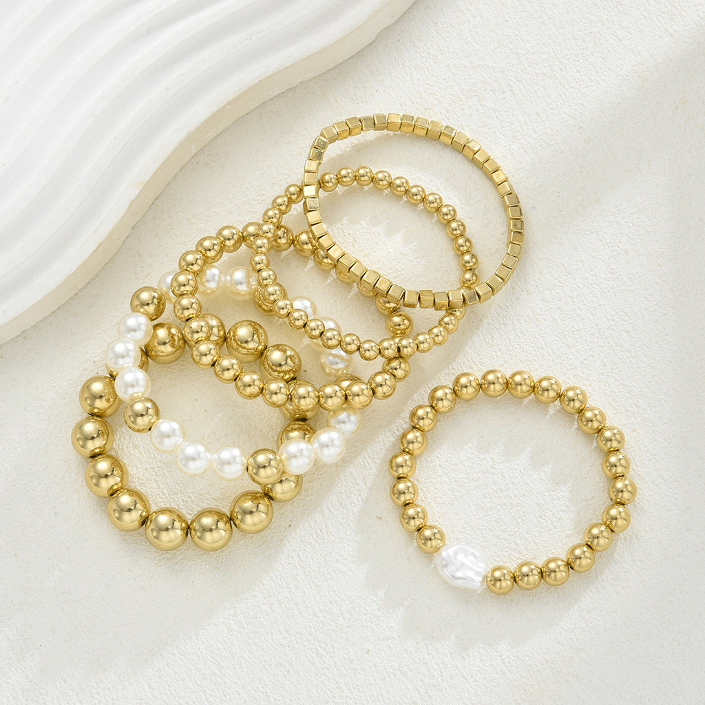 Damen Armreif-Kollektion mit eleganten Perlen und goldenen Akzenten Shop Nory