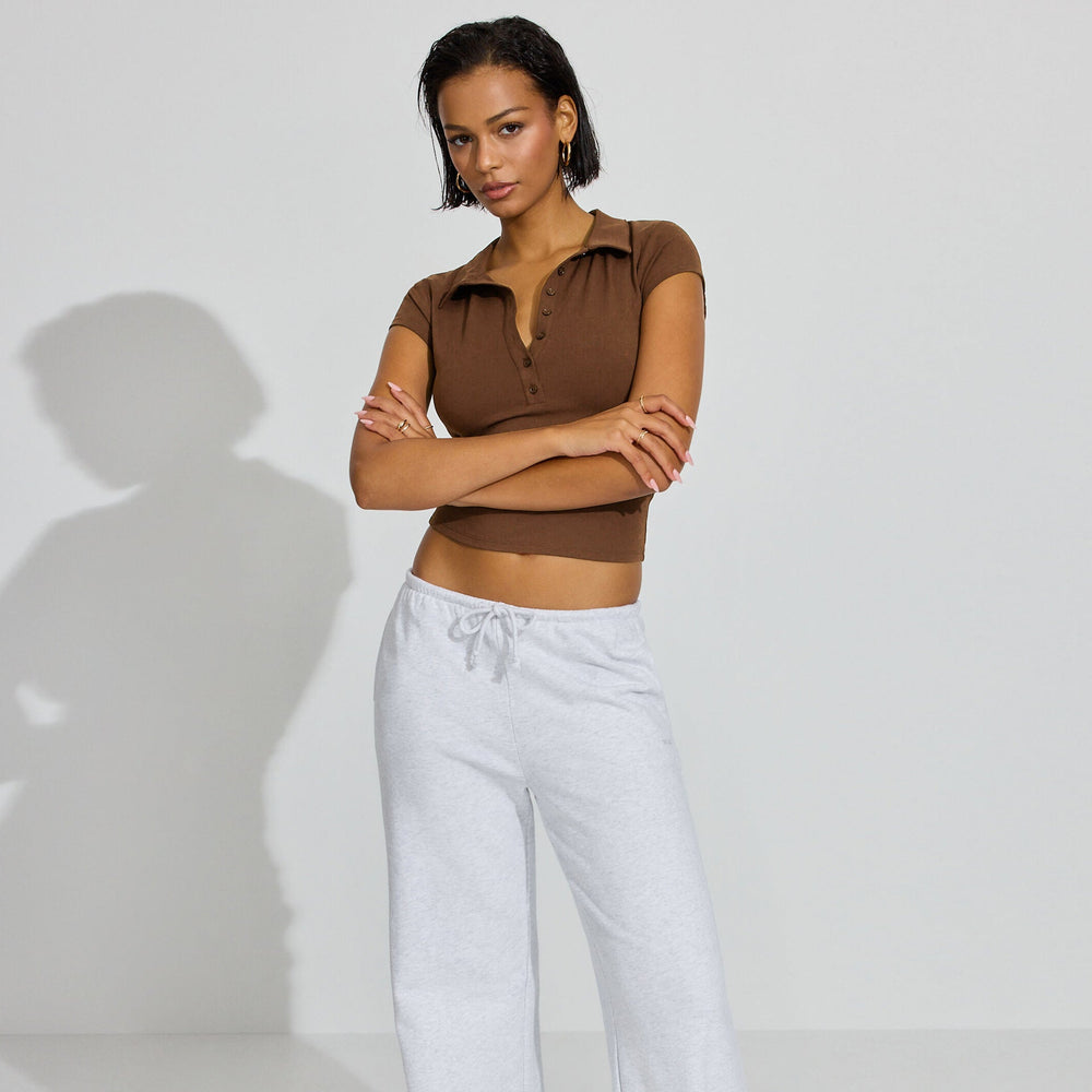 Damen Polo-Shirt mit kurzem Schnitt und modischer Knopfleiste