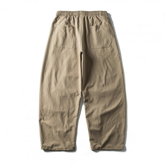 Unisex Weite Cropped-Hose mit Tunnelzug, elastischem Bund und markanten Nahtpaneelen Shop Nory