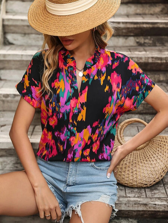 Damen Leichte Oversize Tunika‑Bluse mit Stehkragen, Cap‑Ärmeln und großem Blumenprint Shop Nory