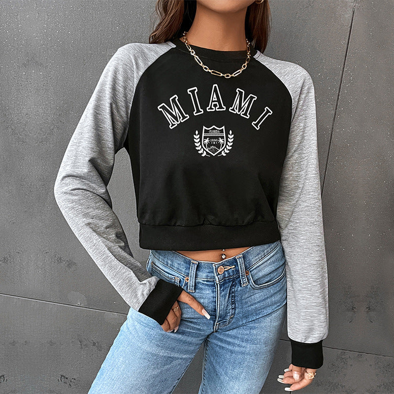 Damen Kurzgeschnittenes College-Cropped-Sweatshirt mit Raglanärmeln und elastischem Saum Shop Nory