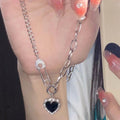 Damen Halskette mit herzförmigem Anhänger und Kettendesign Shop Nory