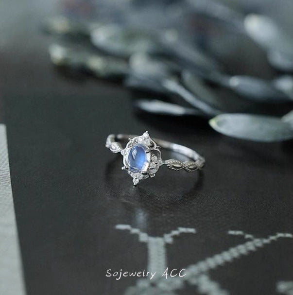 Damen eleganter Ring mit ovalem Stein und kunstvoller Fassung Shop Nory