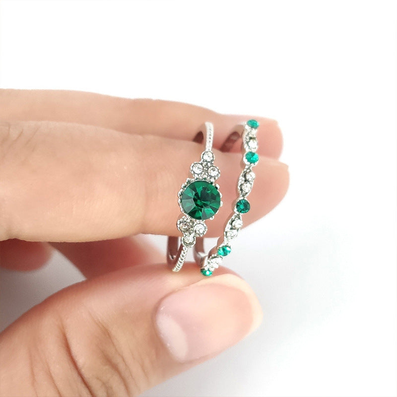 Damen glamouröser Ring mit grünem Edelstein und feinen Zirkoniasteinen Shop Nory