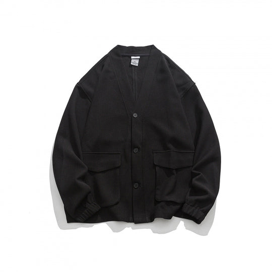 Unisex Oversize-Strickjacke mit großen Klappentaschen und Waffelstruktur Shop Nory