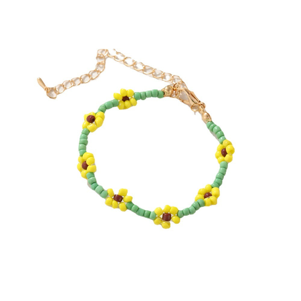 Damen modisches und verspieltes Perlenarmband mit floralem Akzent Shop Nory