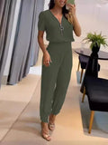 Damen Jumpsuit mit hochgeschlossenem Kragen und seitlichem Reißverschluss