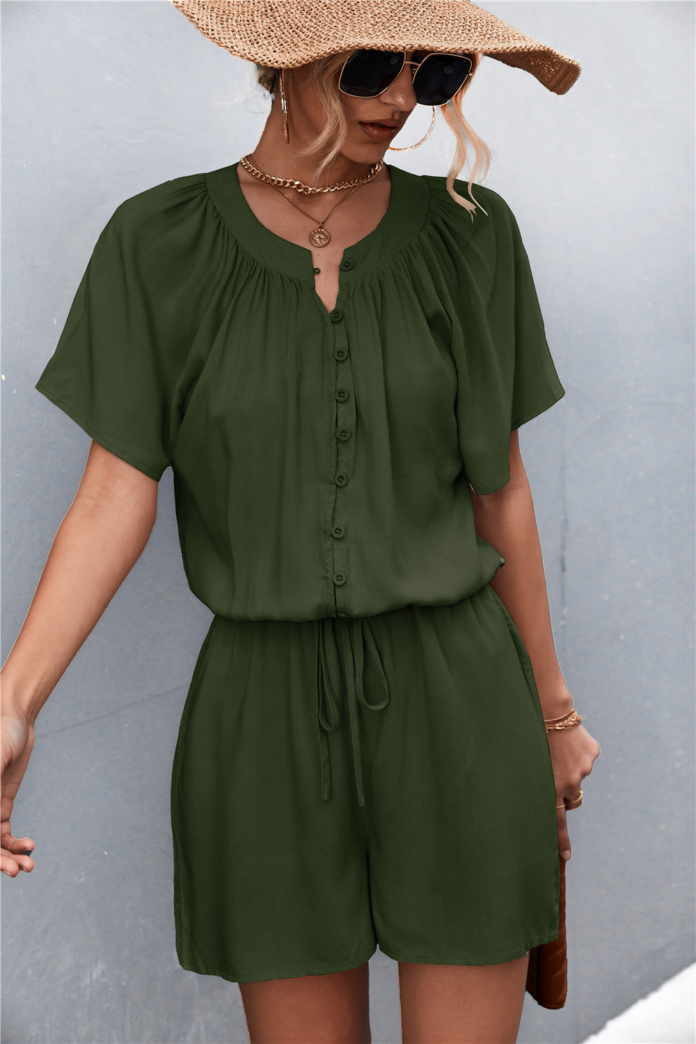 Damen Jumpsuit mit elastischem Bund und knopfverzierter Front