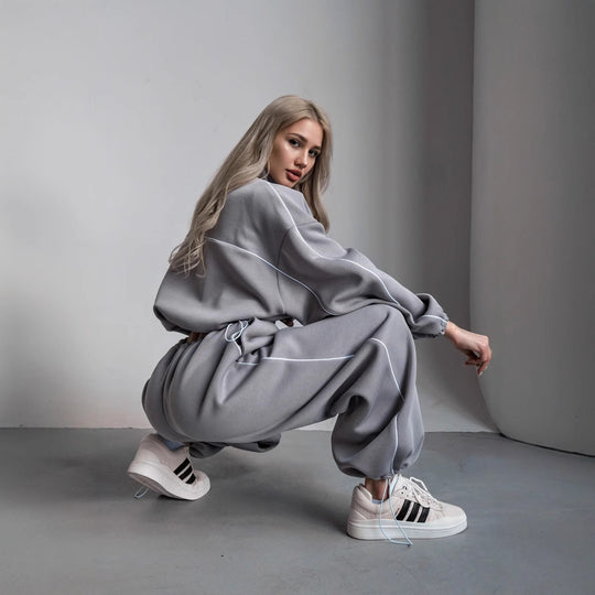 Damen cropped Zip-Kapuzenjacke mit Tunnelzug-Bund, oversized Ärmeln und kontrastierender Paspel Shop Nory