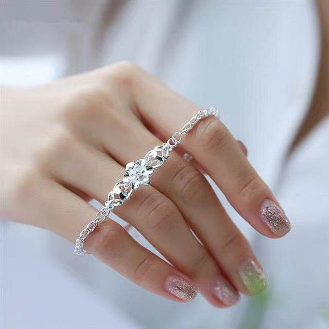 Damenarmband mit filigranem Blumendesign und elegantem Zirkonia-Besatz Shop Nory