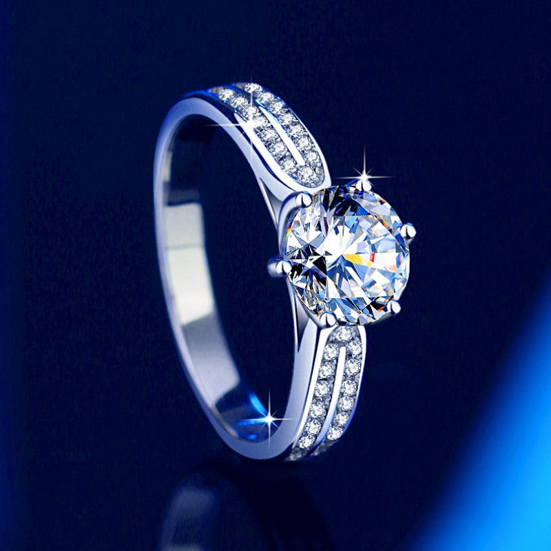 Damen Verlobungsring mit funkelndem runden Zirkonia und eleganter Fassung Shop Nory