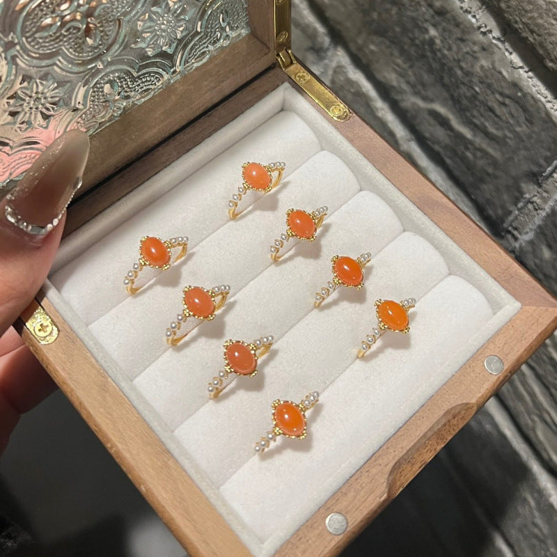 Damenring mit ovalem Rosenquarz und filigranem Golddesign Shop Nory