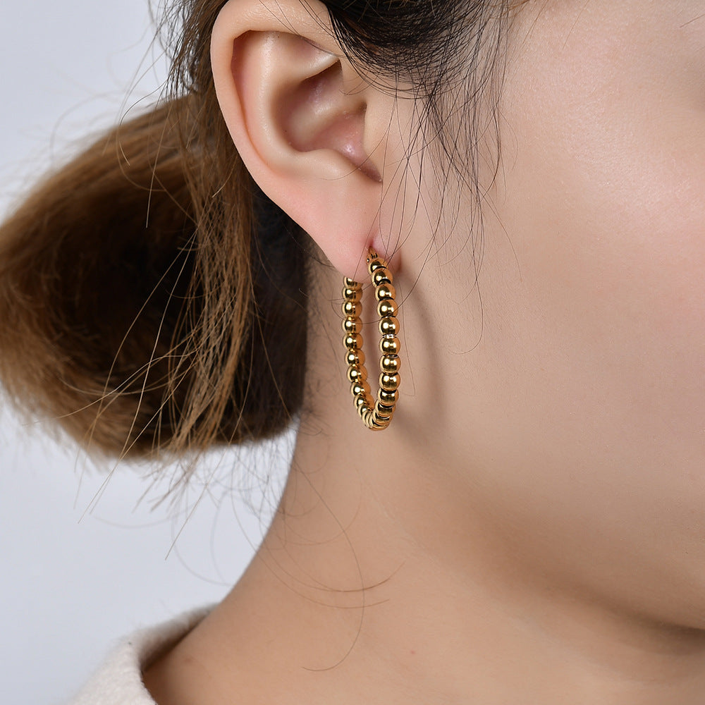 Damen Creolen aus hochwertigem Edelstahl mit glänzenden Kugeldetails Shop Nory