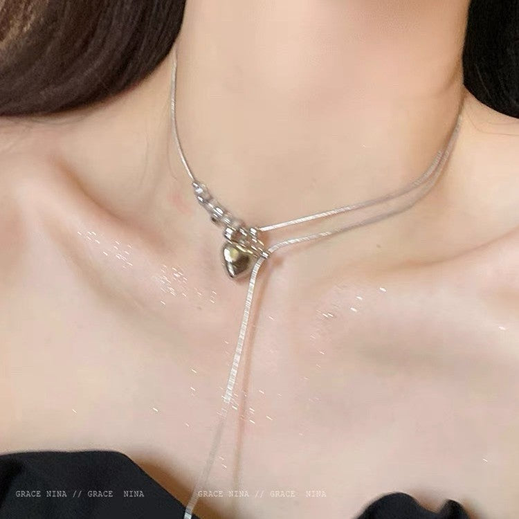 Damen Halskette mit glänzendem Herzanhänger und edlen Kristallelementen Shop Nory