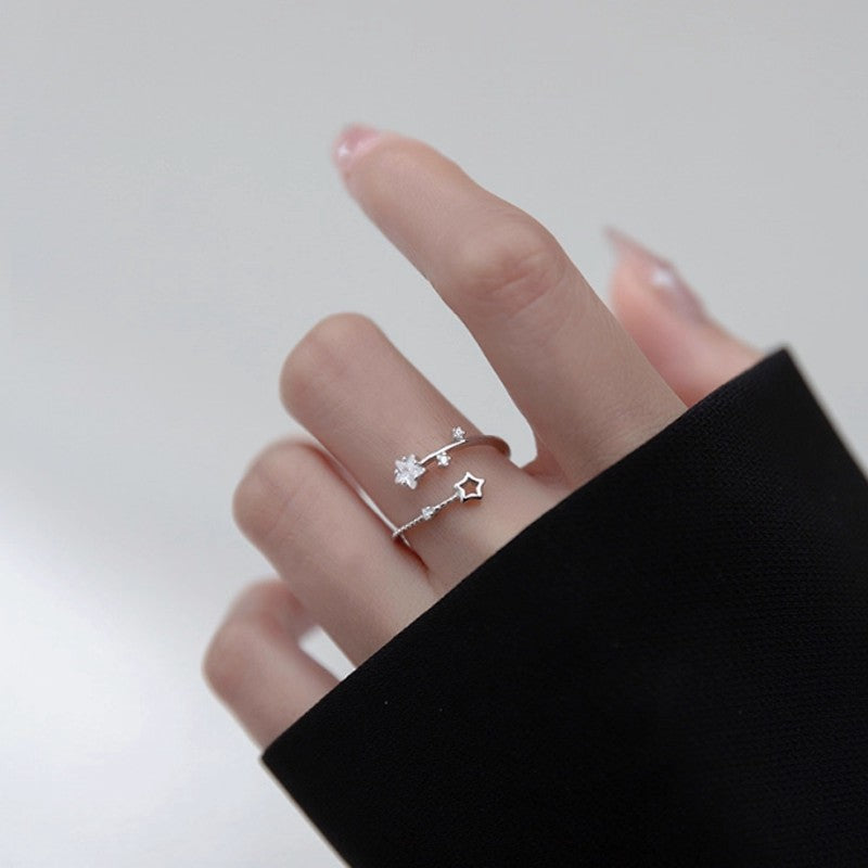 Damen eleganter und zarter Ring mit Stern- und Blütenmotiven Shop Nory