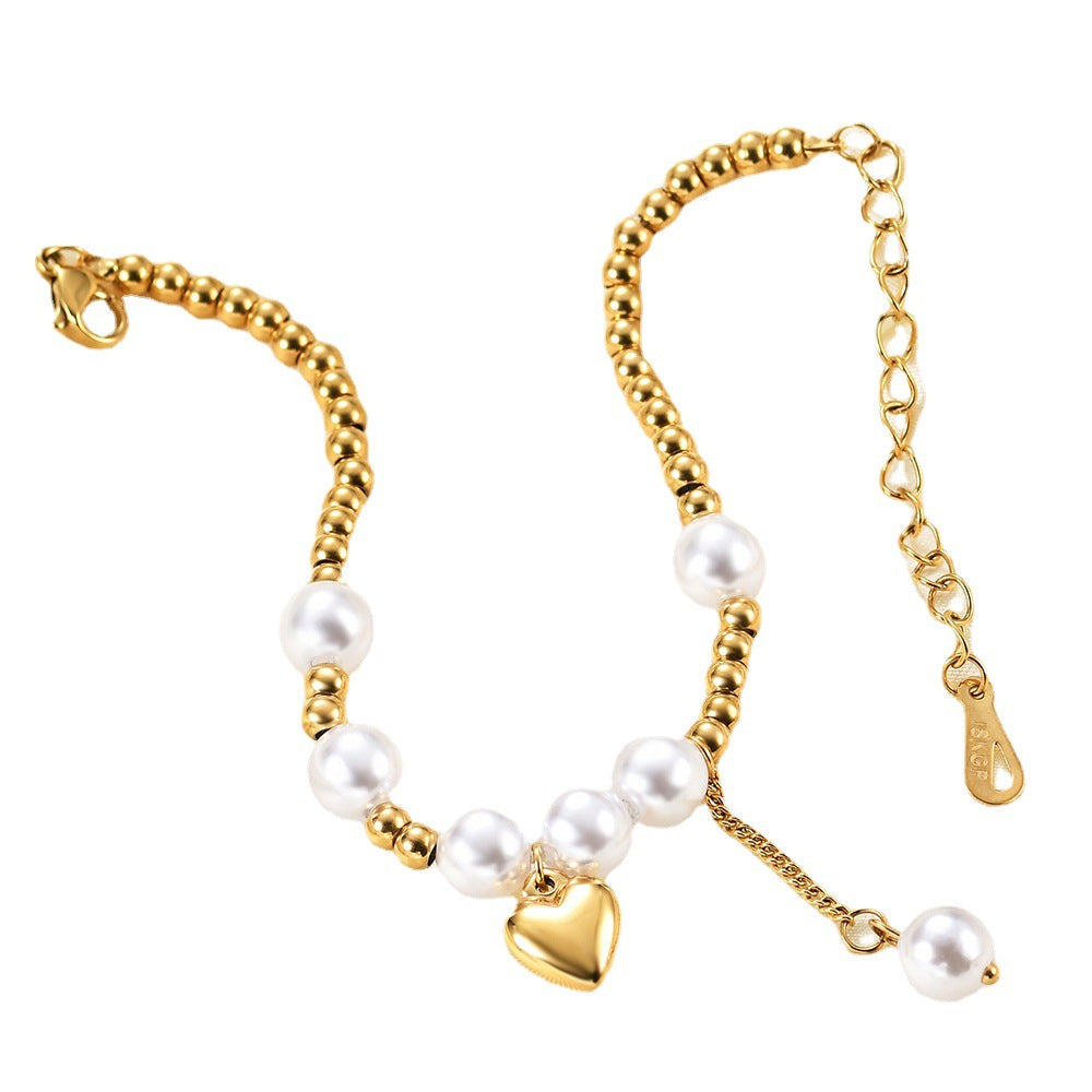 Damen Armband mit Herzanhänger und Perlenakzenten Shop Nory