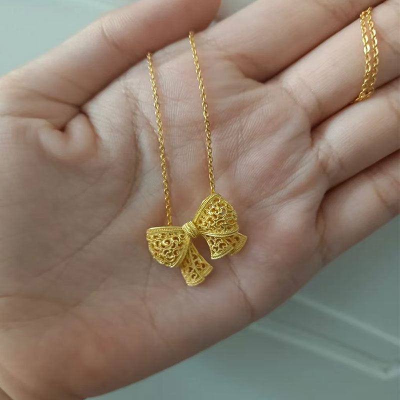 Damen Halskette mit kunstvollem Schleifenanhänger Shop Nory
