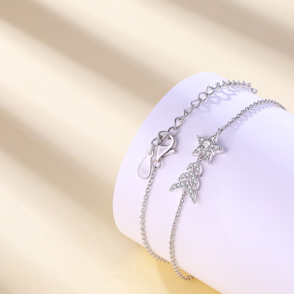 Damenarmband mit funkelnden Stern- und Blattmotiven Shop Nory