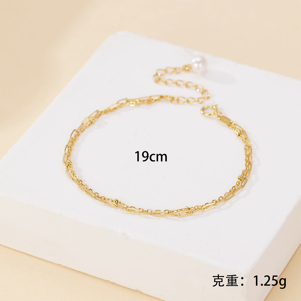 Damen filigranes Armband mit doppeltem Kettendesign, edlen Perlendetails und hochwertiger Verarbeitung Shop Nory