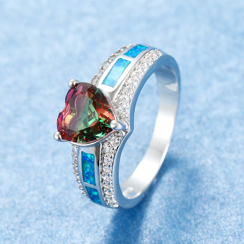 Damen Ring mit herzförmigem smaragdgrünem Stein und feinen Zirkonia-Details Shop Nory
