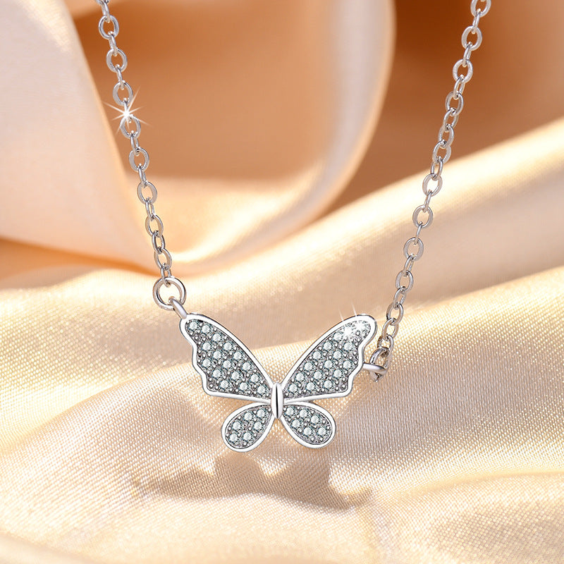 Damen Halskette mit filigranem Schmetterlingsanhänger und funkelnden Zirkonia Shop Nory