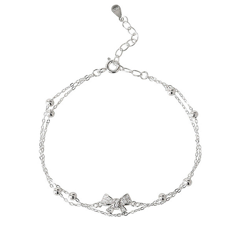 Damen Armband mit zartem Schleifen-Design und funkelnden Kristallen Shop Nory